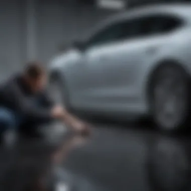 Skilled technician inspecting car surface