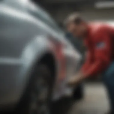 Skilled painter applying custom paint to car body