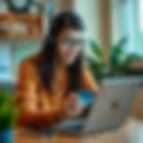 A young adult reviewing credit card options on a laptop