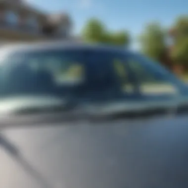 Illustration of a cracked windshield on a car parked in a driveway